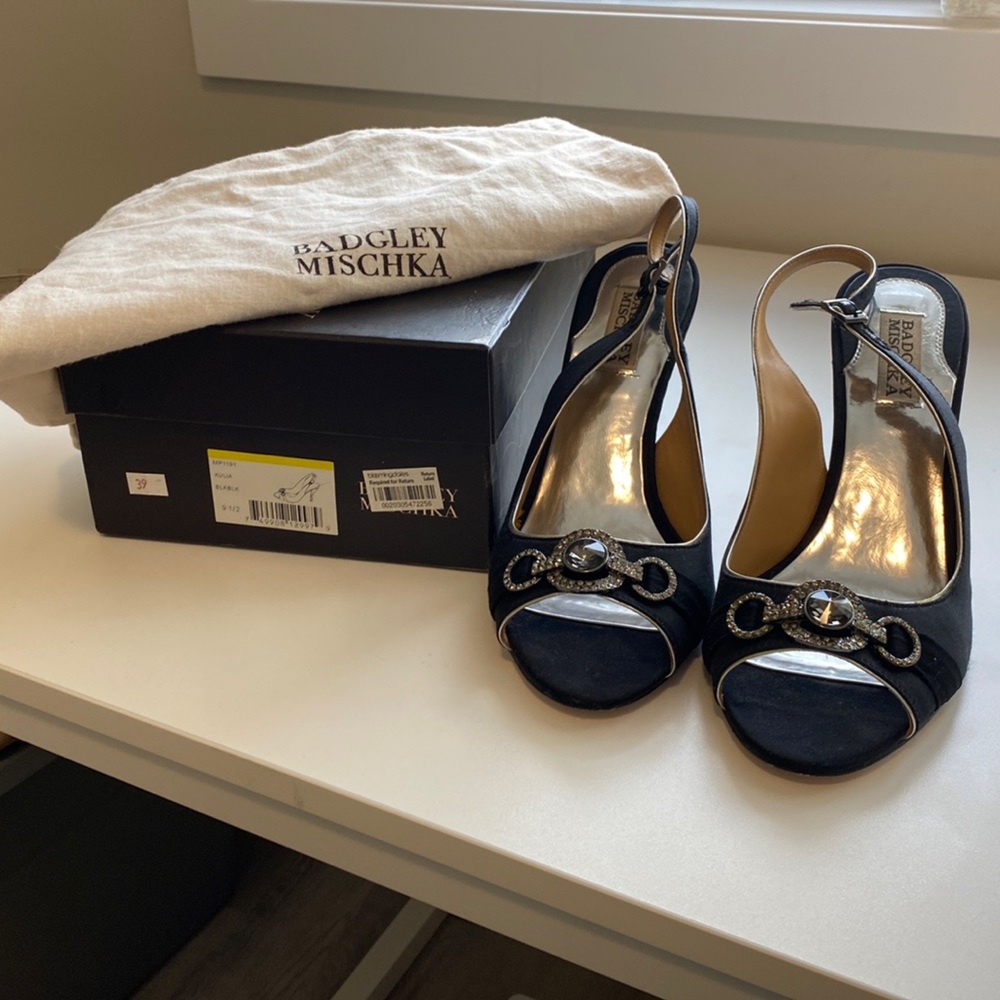 Cute satin pump with rhinestone detail.